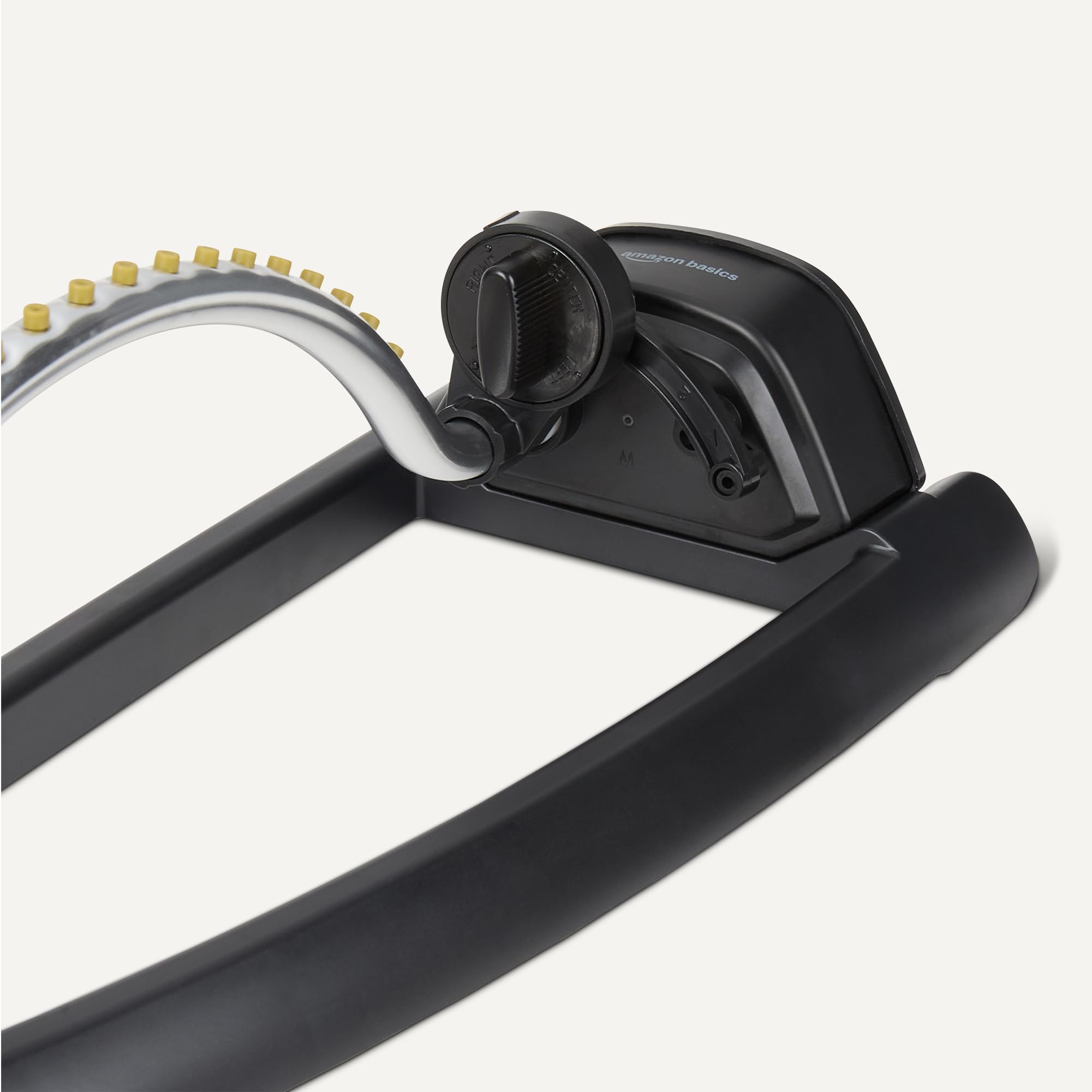 Basics Oscillating Lawn Sprinkler in garden setting with flowers