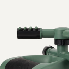 Basics Whirling Rotating Lawn Sprinkler in action watering a lawn
