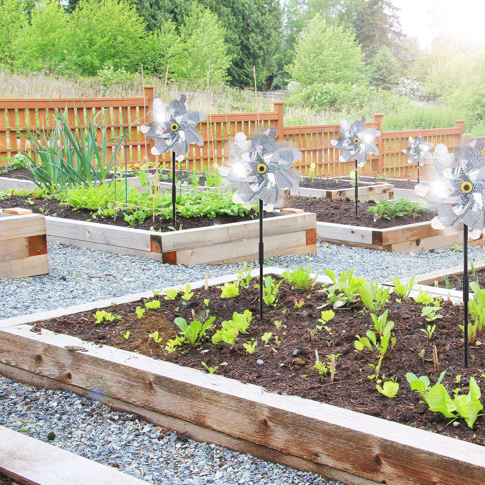 BATTIFE garden pinwheels installed among flowers