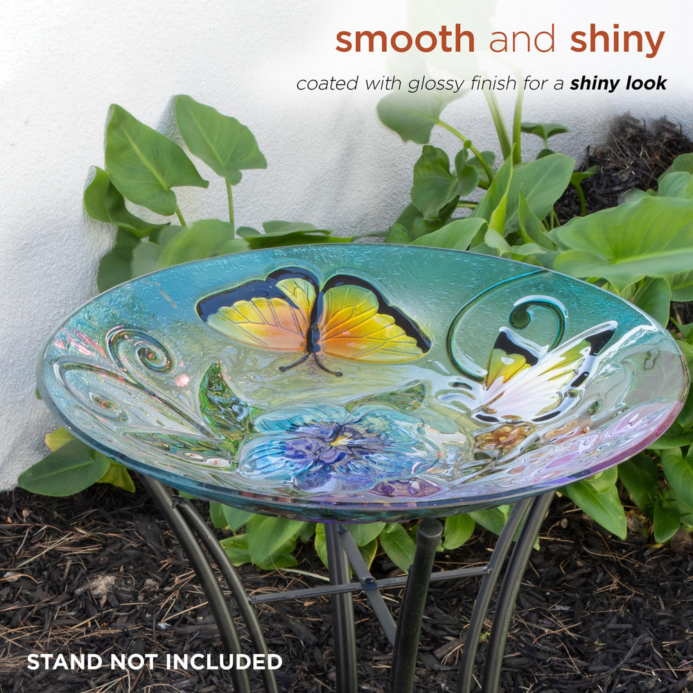 Birdbath filled with water, attracting birds