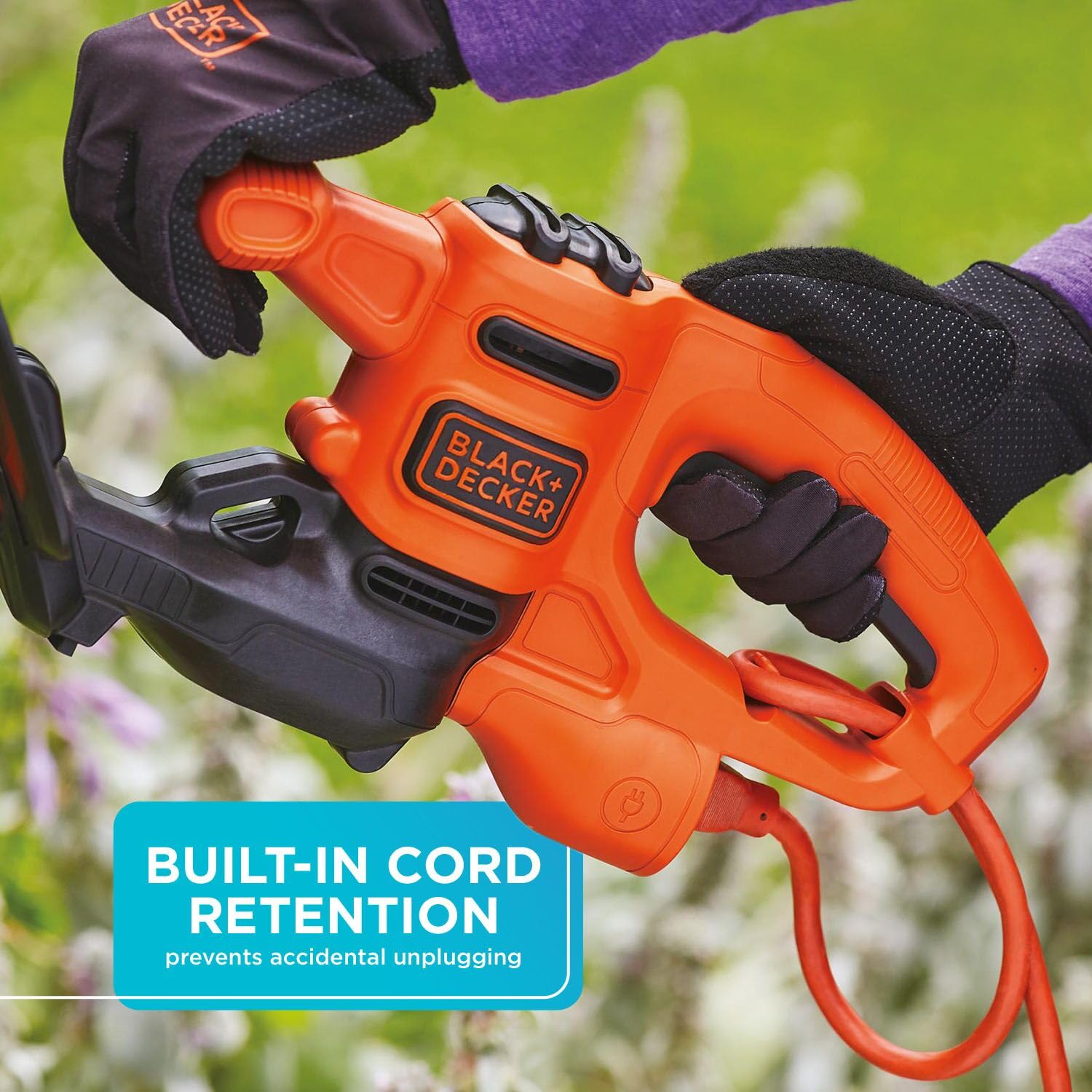 BLACK+DECKER 16-Inch Electric Hedge Trimmer in a garden setting