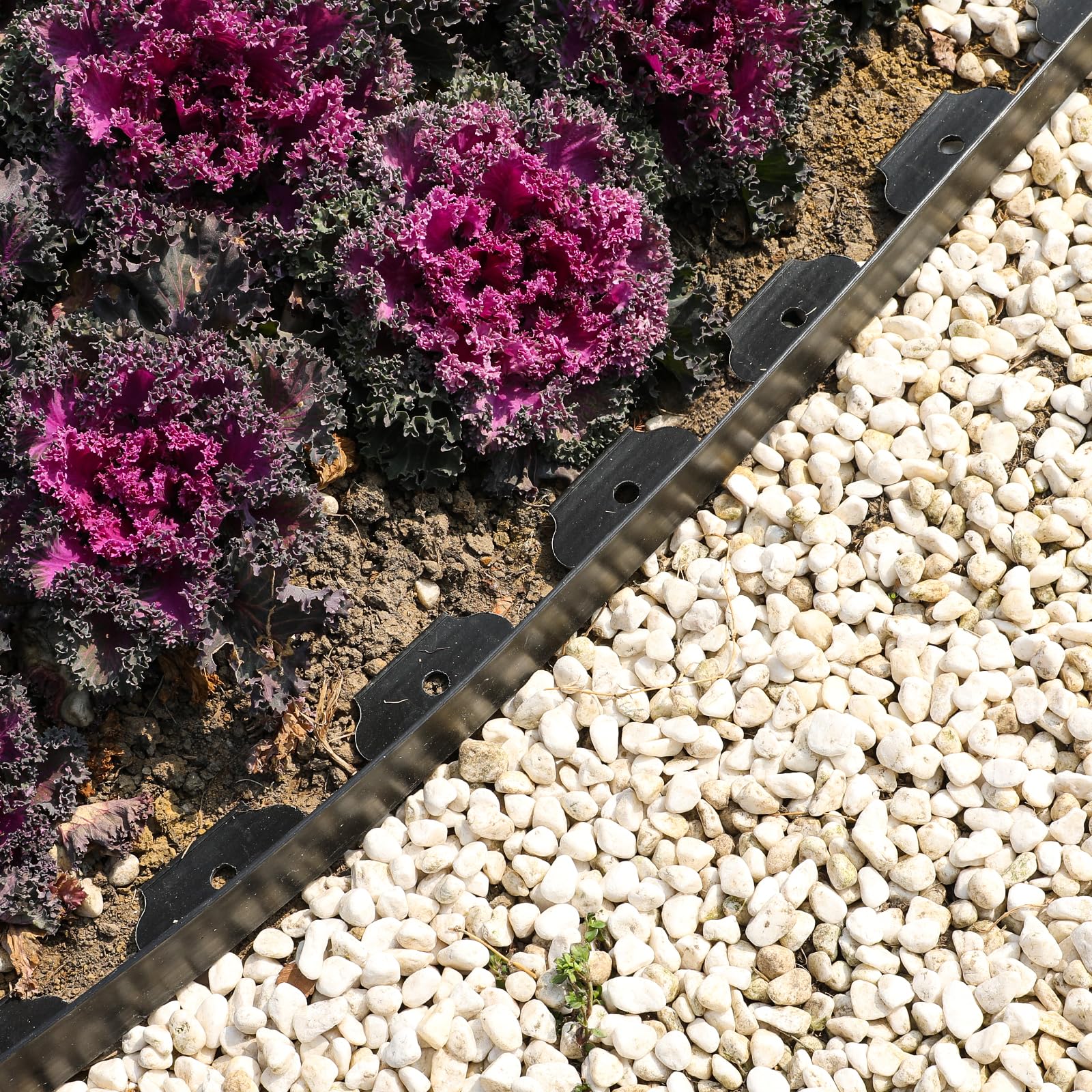 Black Hemikaki Garden Edging installed along a pathway