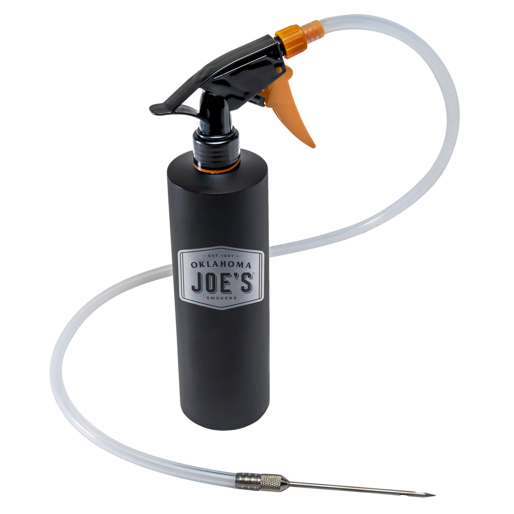 Black Oklahoma Joe's spray bottle and injector on outdoor grill