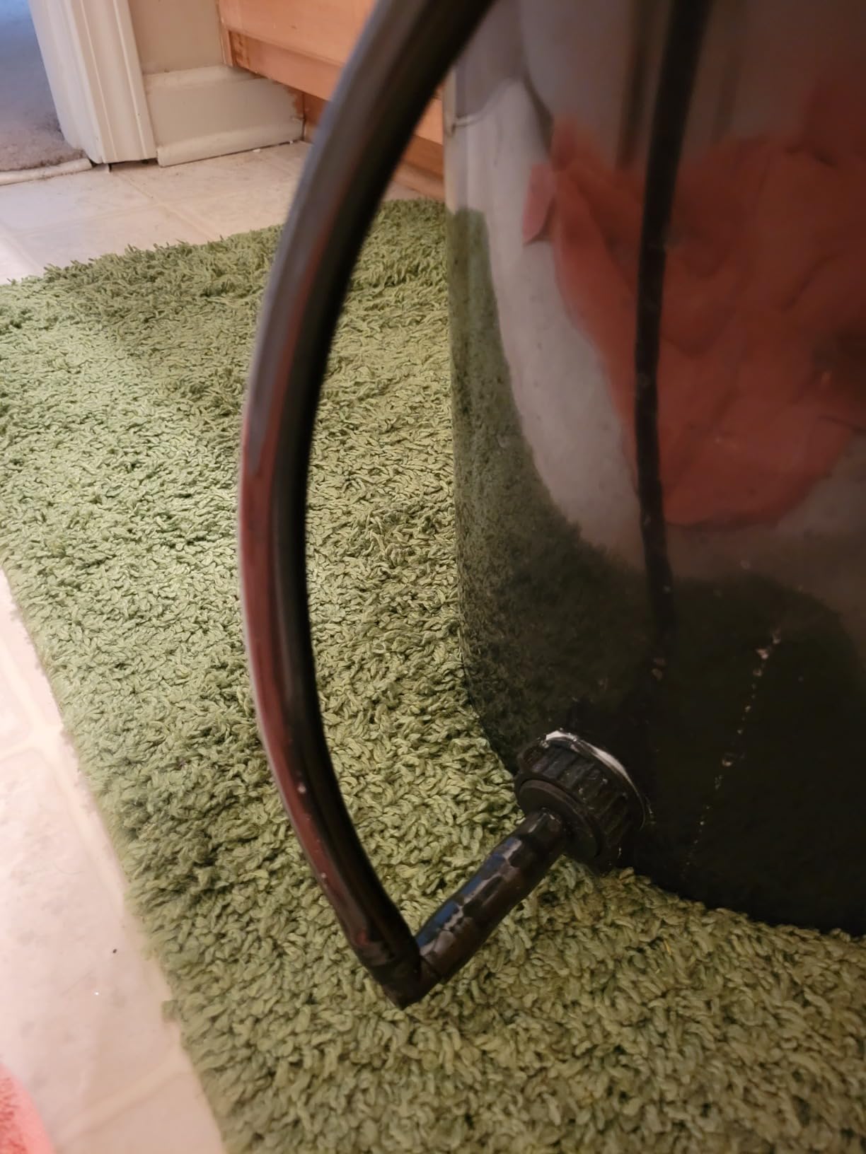 Black vinyl tubing in a garden setting for irrigation
