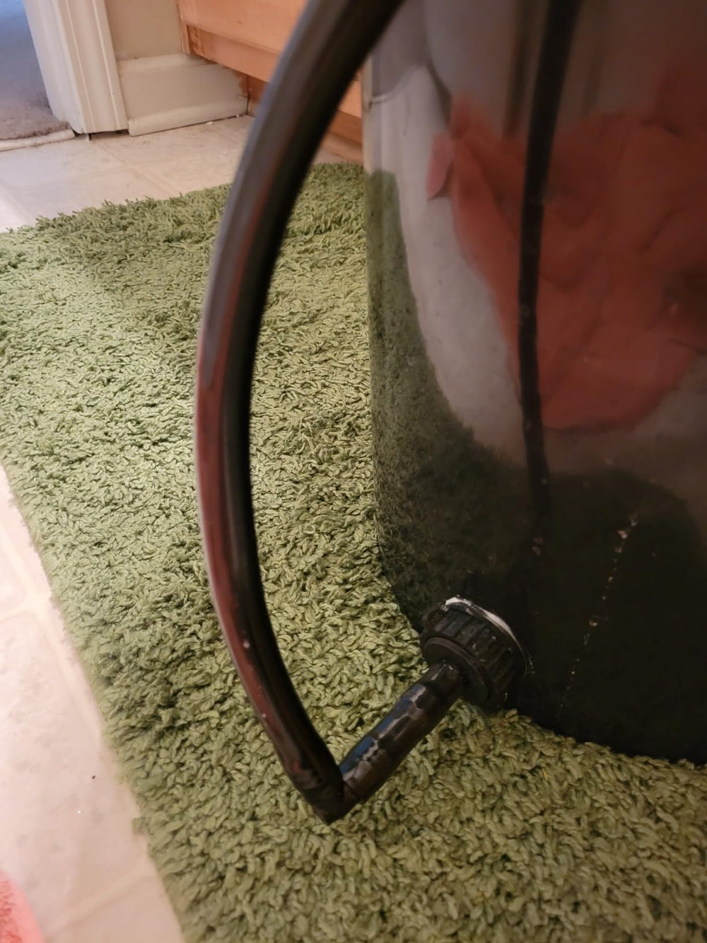 Black vinyl tubing in a garden setting for irrigation