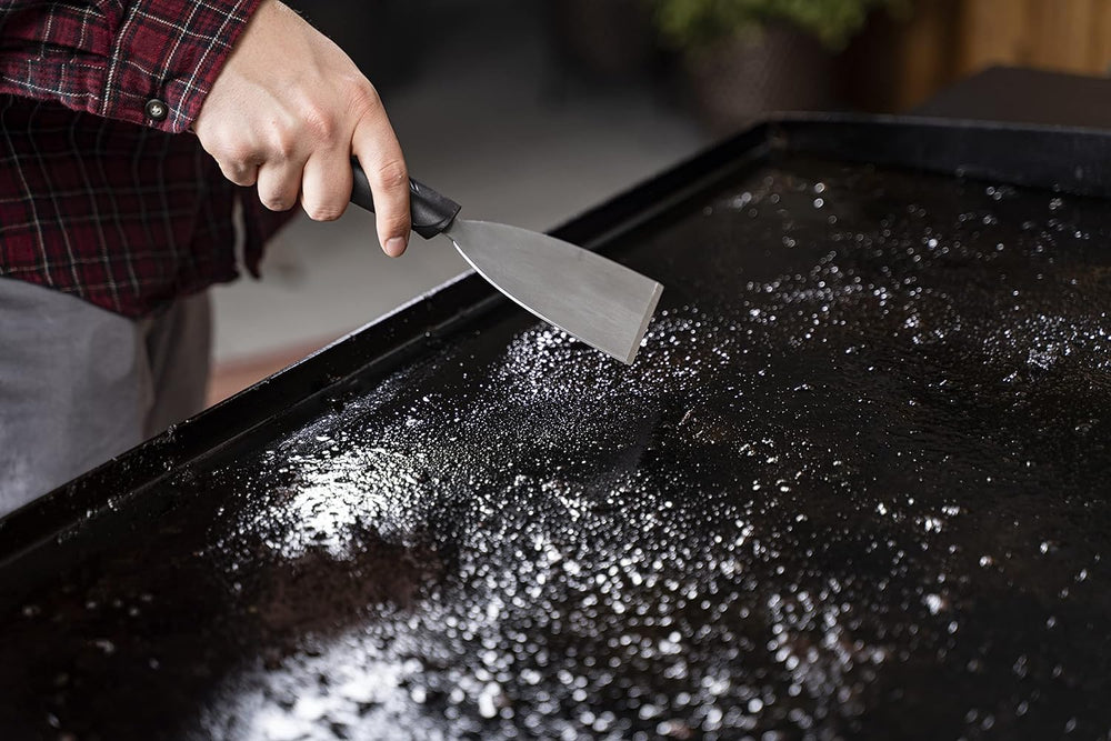 BLACKSTONE cleaning tools arranged on a flat surface