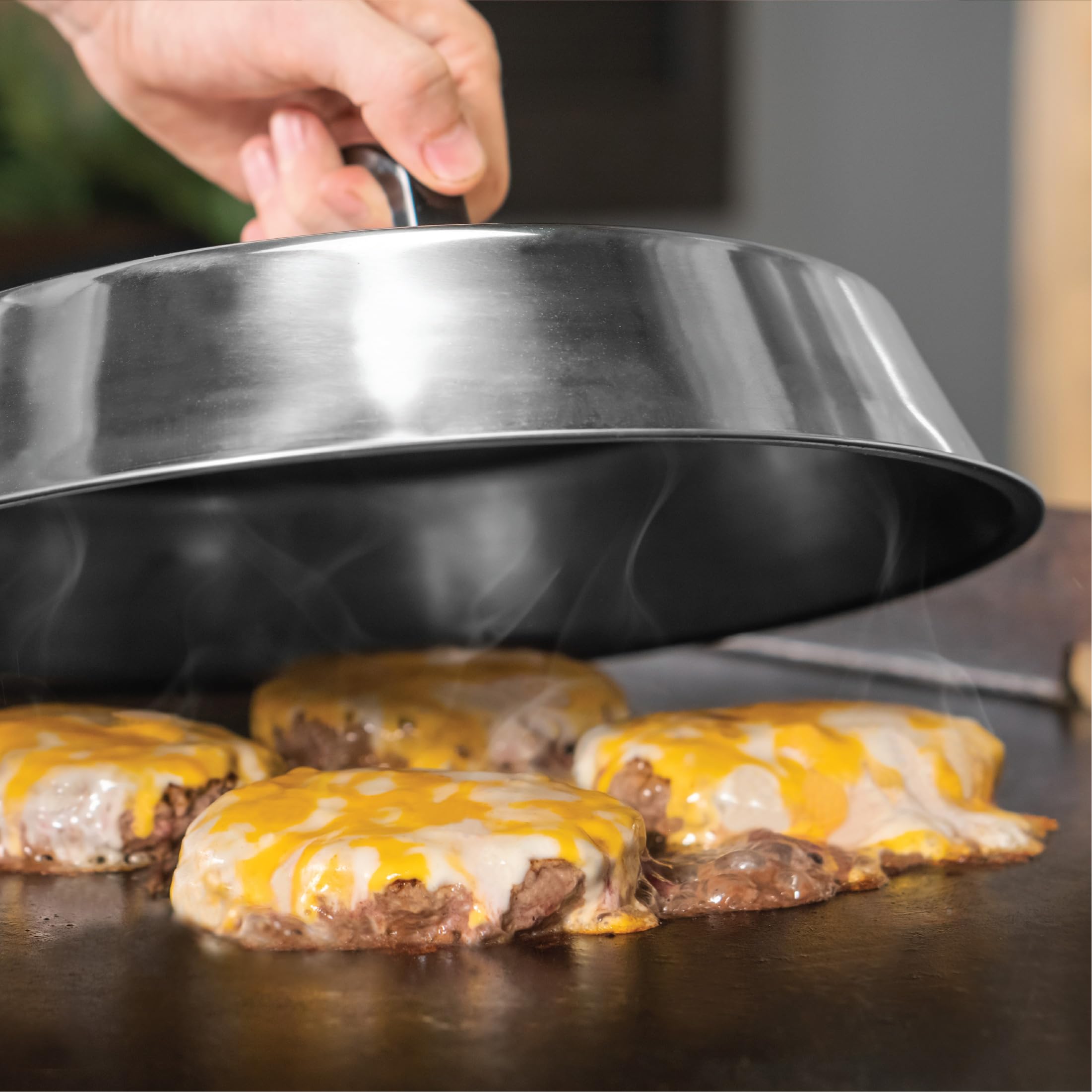 BLACKSTONE griddle tools in use on a grill