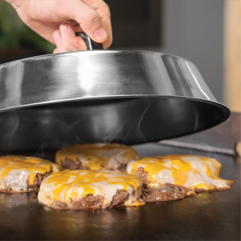 BLACKSTONE griddle tools in use on a grill