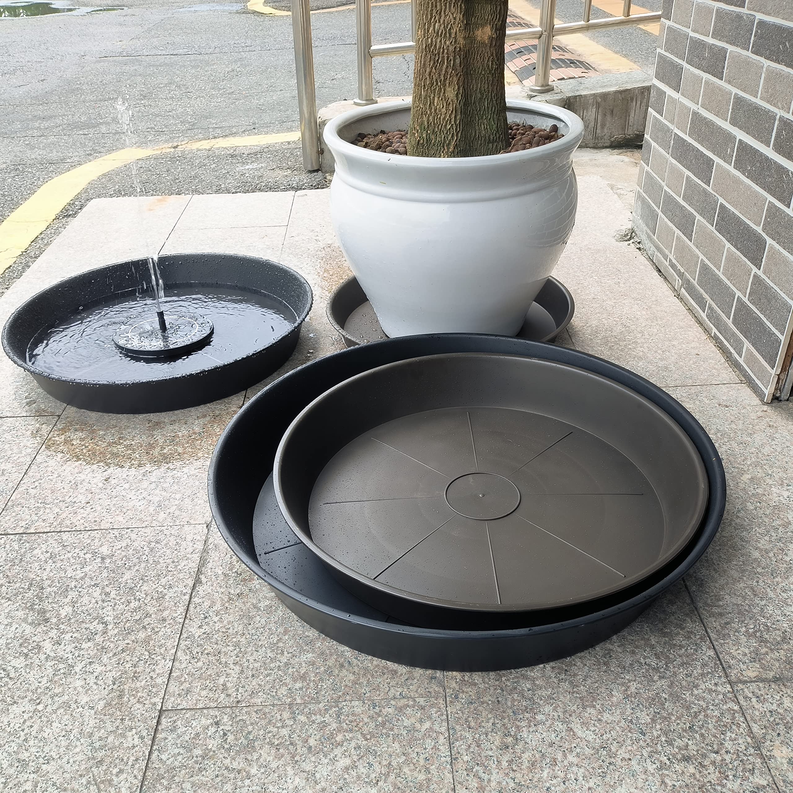 Bleuhome 22-inch plant saucer in a garden setting