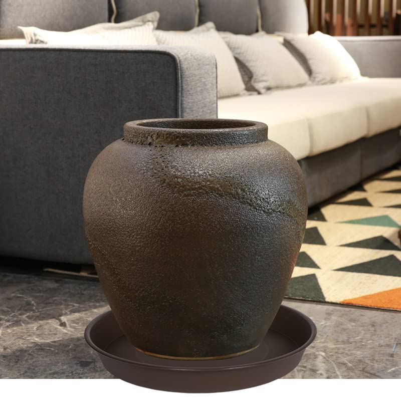 Bleuhome plant saucer next to gardening tools