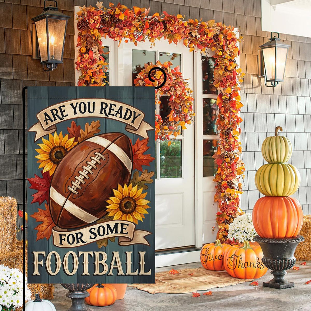 BLKWHT Fall Football Garden Flag displayed outdoors