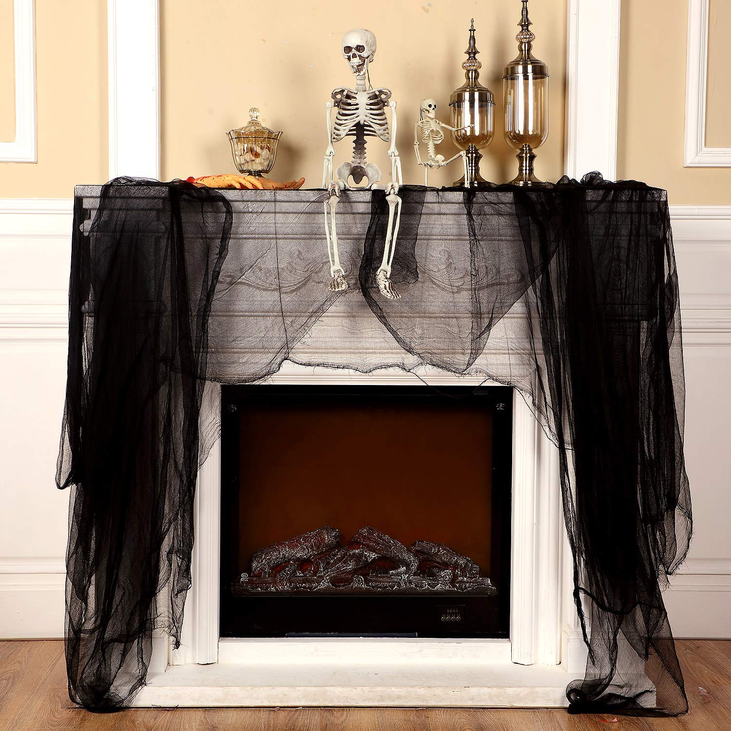 Boao Cheesecloth Roll draped over a window for Halloween decor