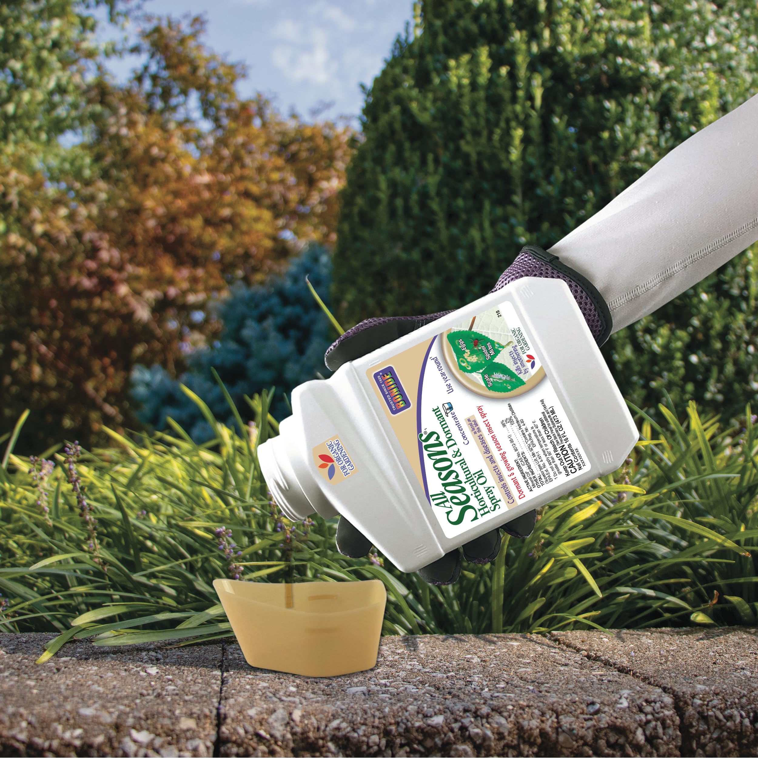 Bonide All Seasons Horticultural & Dormant Spray Oil 16 oz displayed in a garden setting