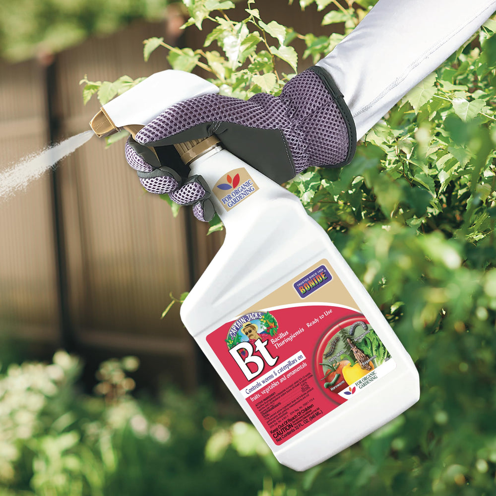 Bonide Captain Jack's BT spray bottle with plants in the background