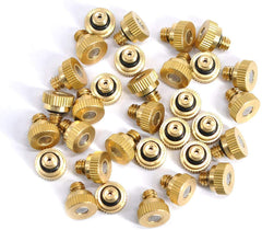 Brass misting nozzle installed in a garden system