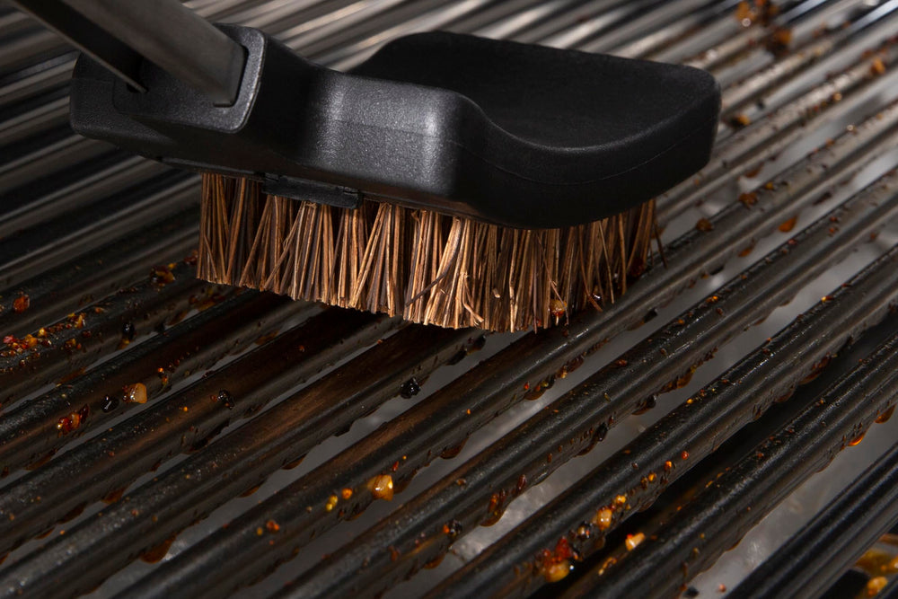 Broil King grill brush replacement heads beside a grill