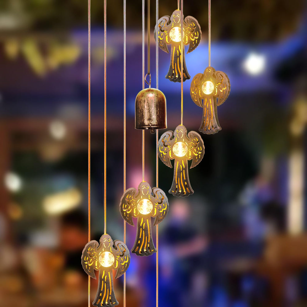 Bronze wind chimes glowing at night with LED lights