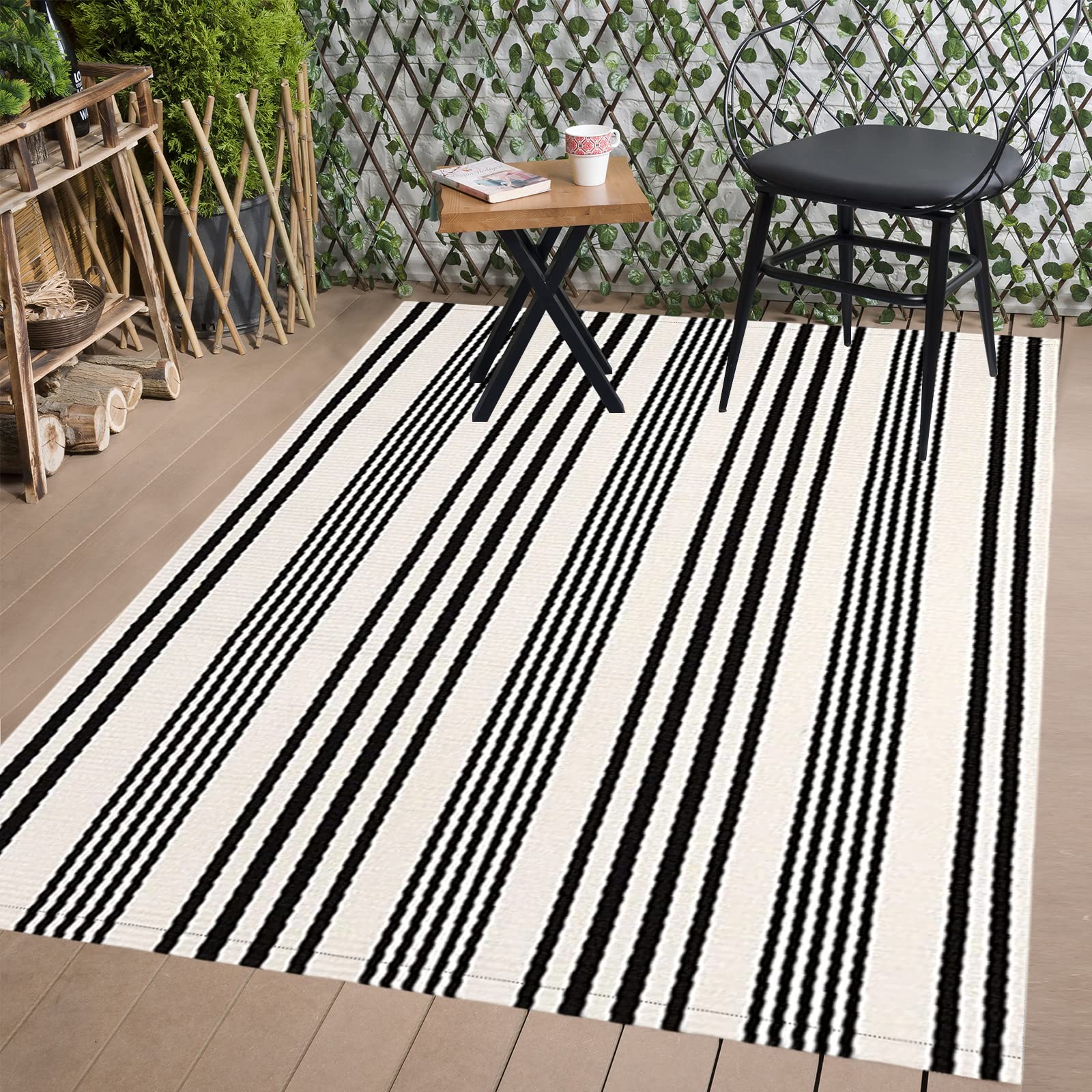 BUAGETUP Black and White Outdoor Patio Rug rolled up