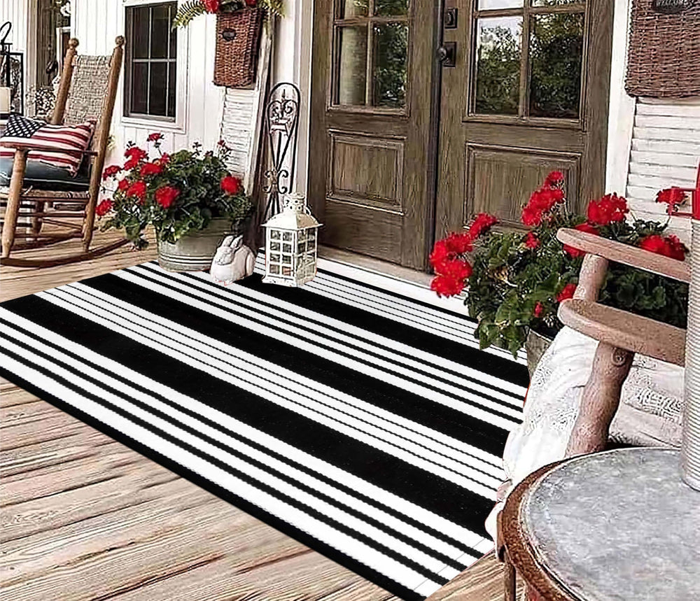 BUAGETUP Black and White Outdoor Rug rolled up