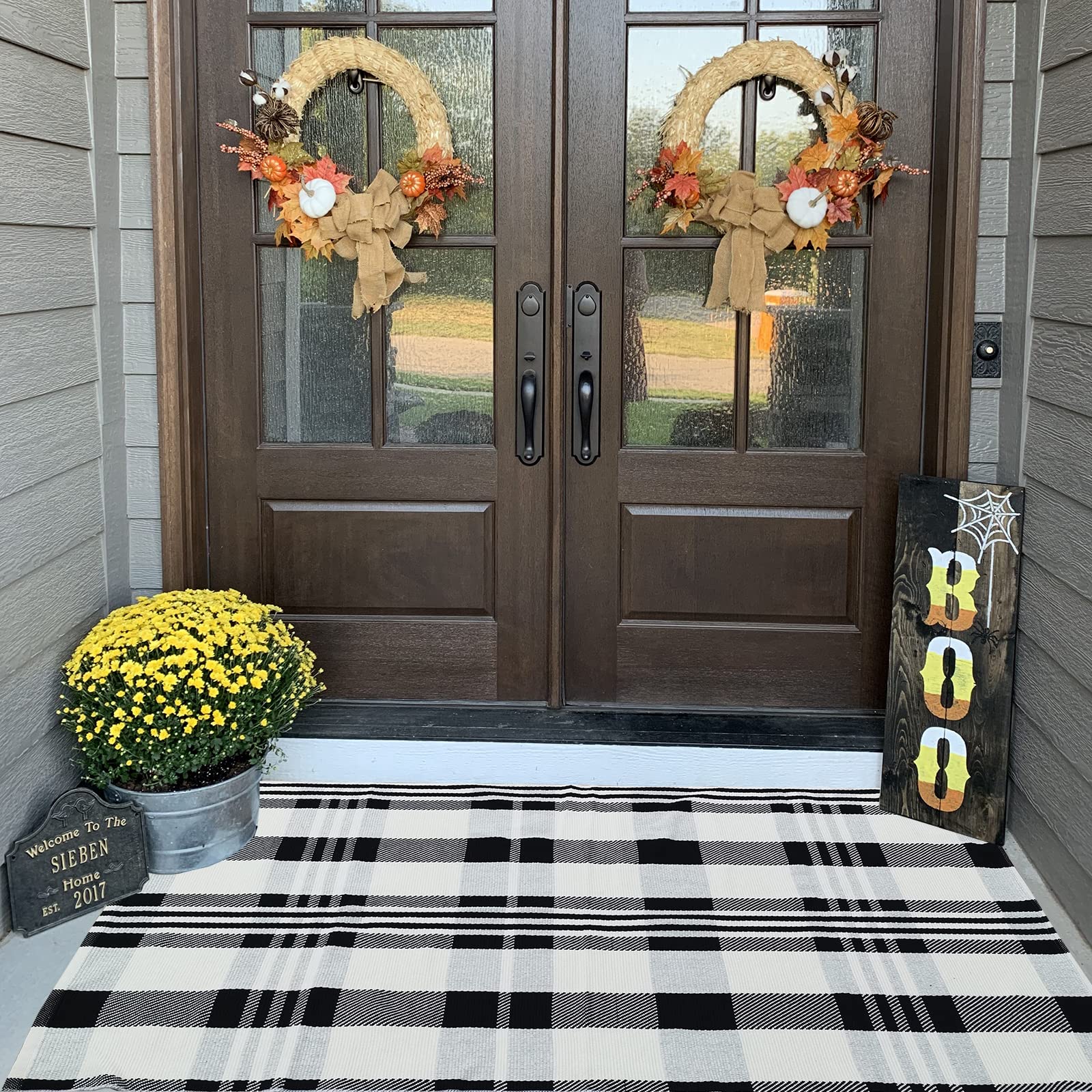 CAINANEL Buffalo Plaid Outdoor Rug being cleaned