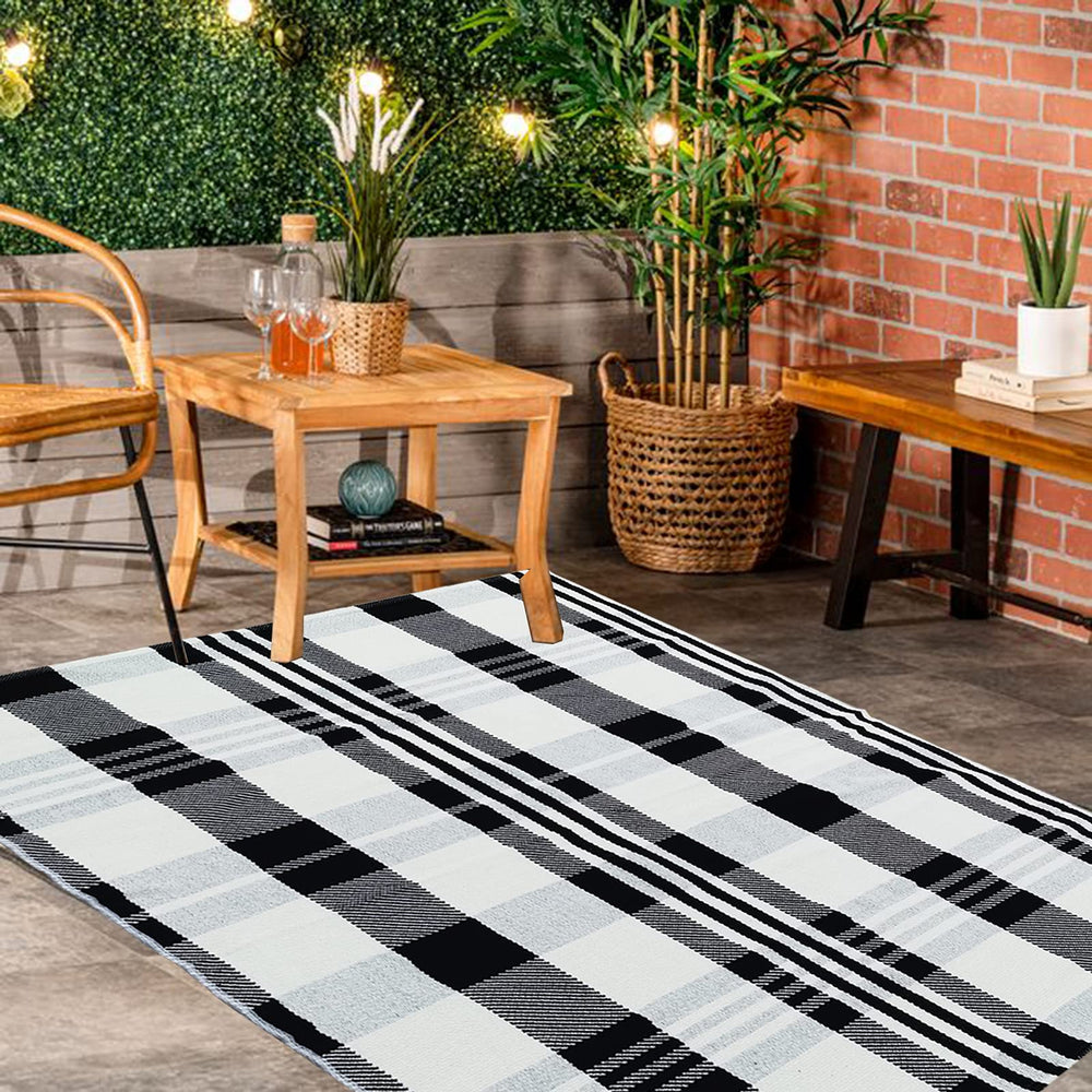 CAINANEL Buffalo Plaid Outdoor Rug rolled up for storage