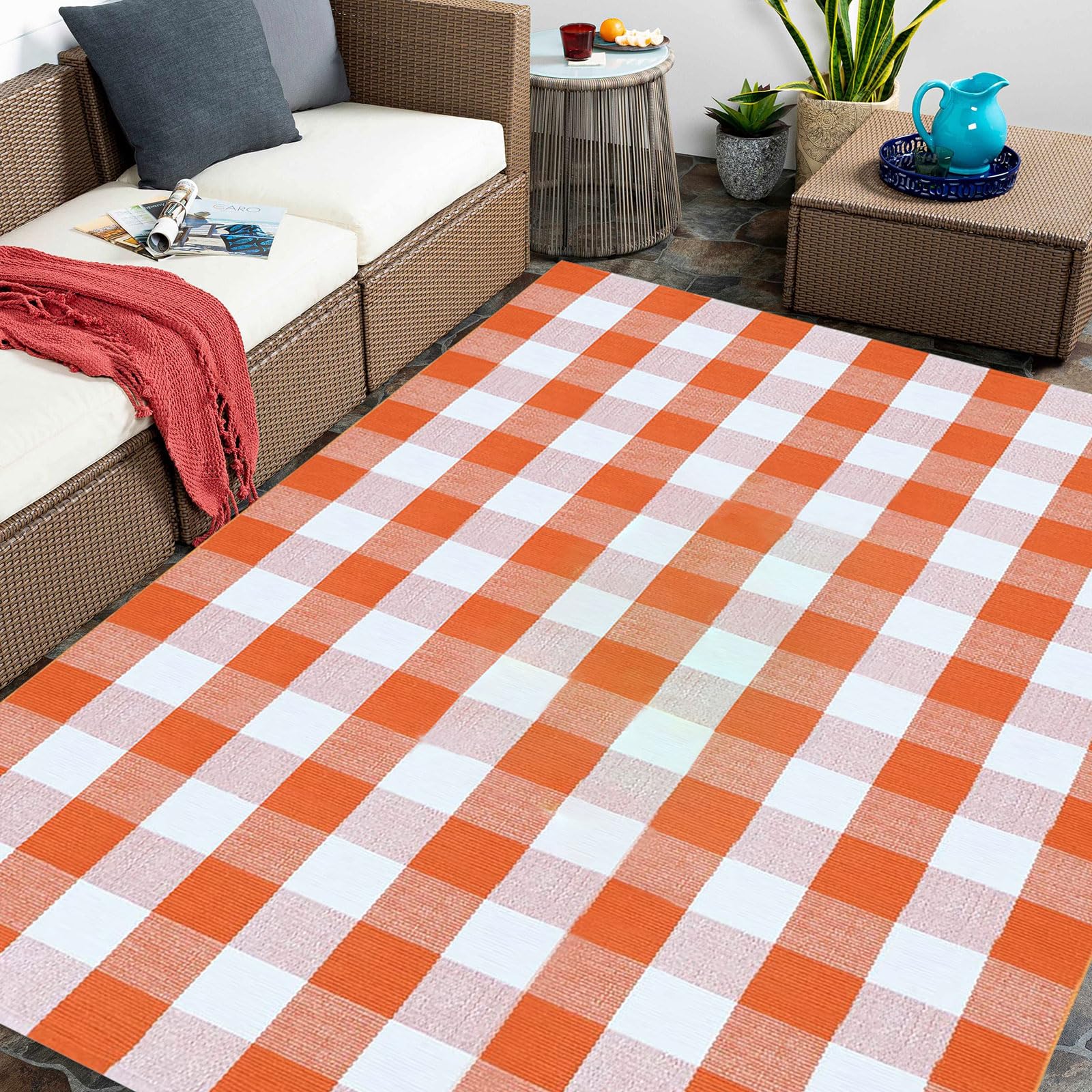 CAINANEL orange plaid rug on patio