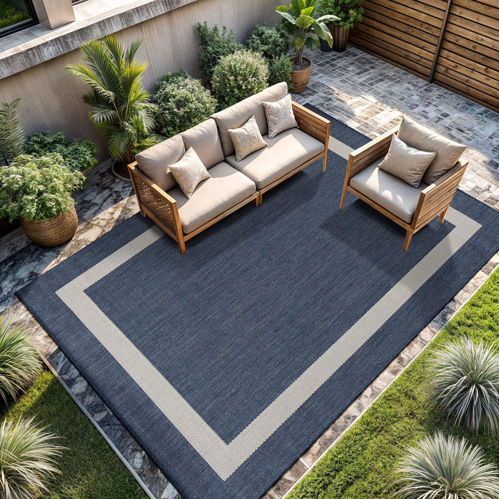 CAMILSON Outdoor Rug 6x9 blue and white bordered design front view