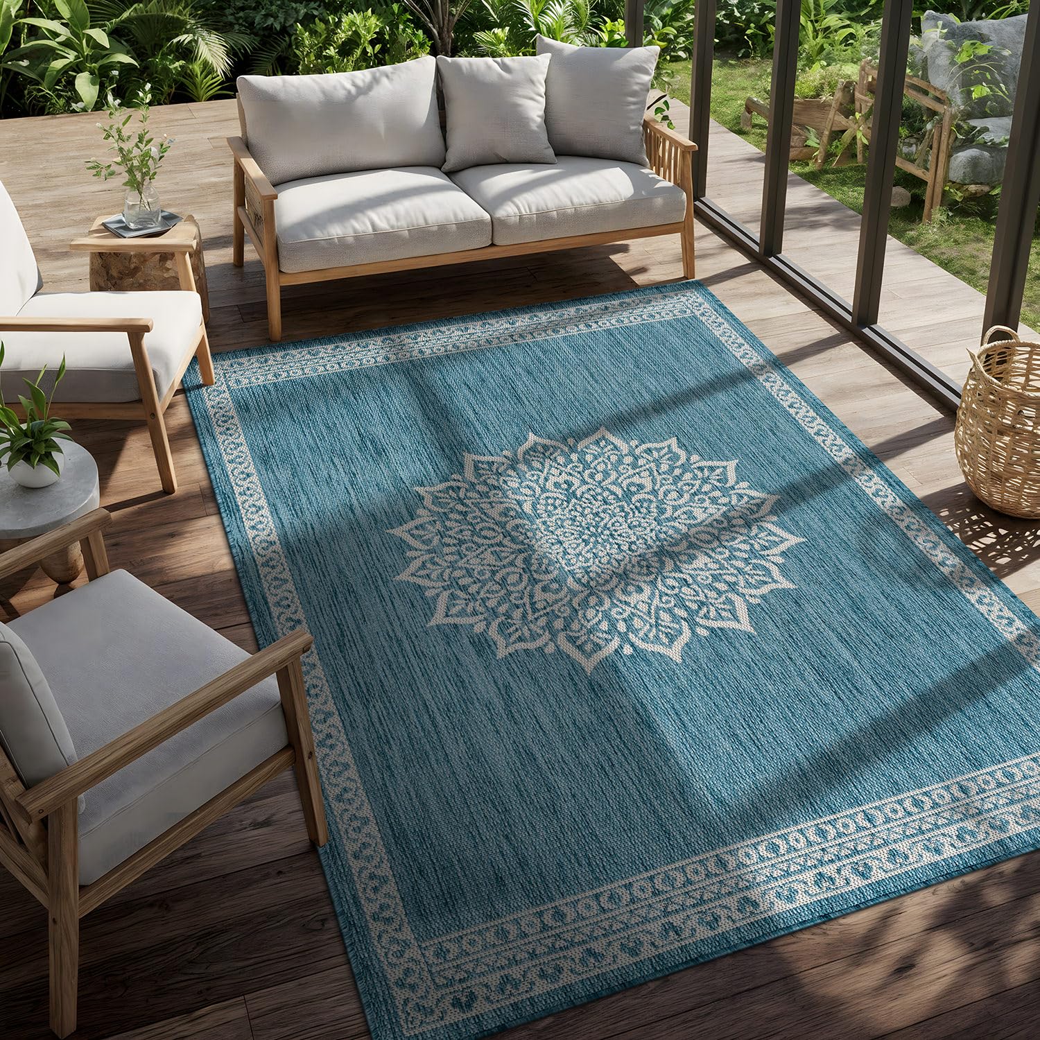 CAMILSON Outdoor Rug 6x9 Medallion Aqua rolled up for storage