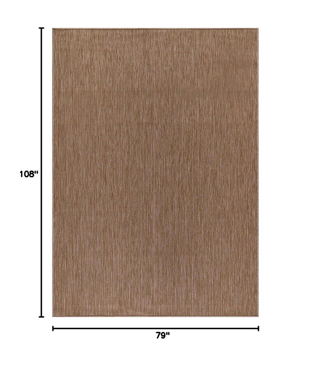 CAMILSON Outdoor Rug 6x9 on a patio setting