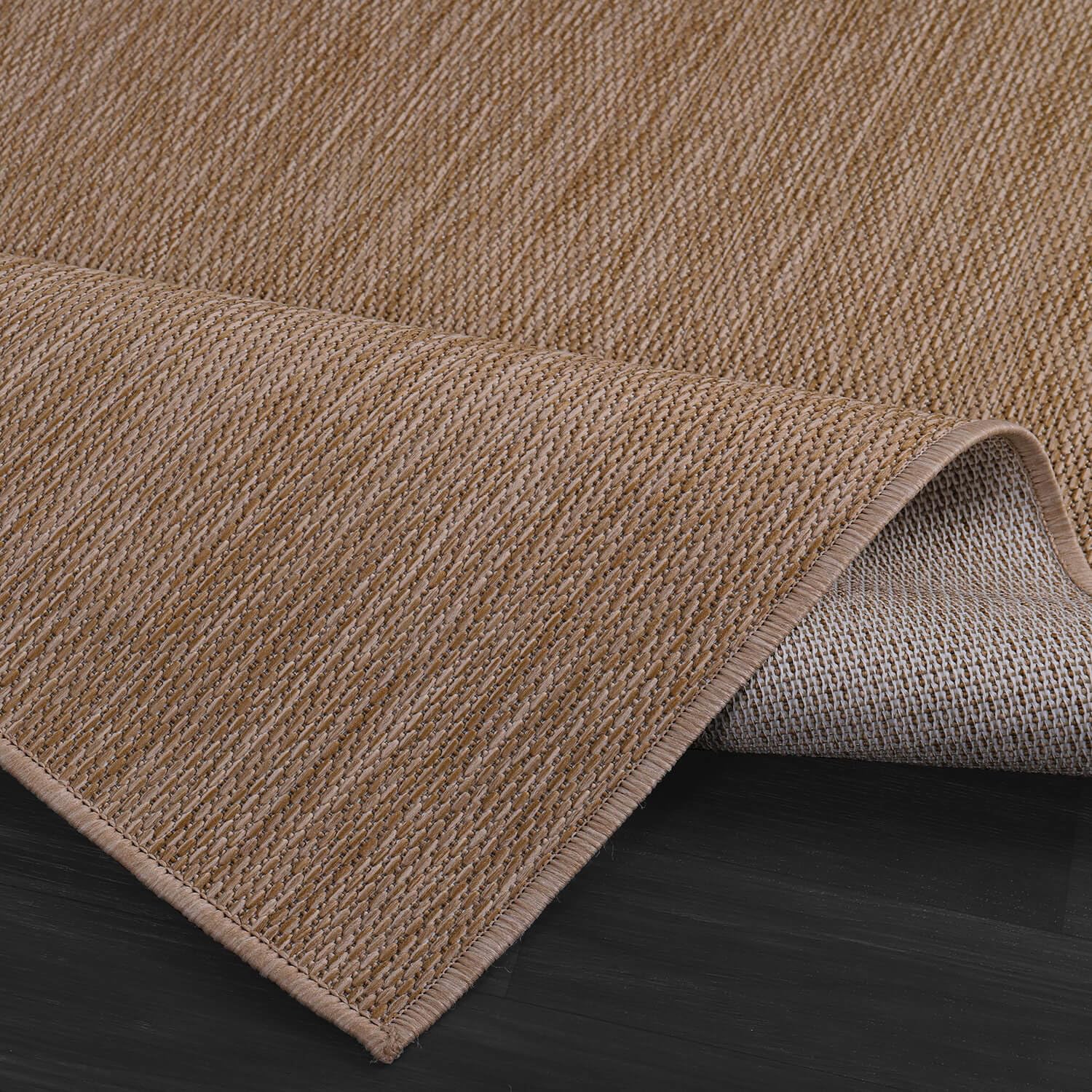 CAMILSON Outdoor Rug displayed in a garden