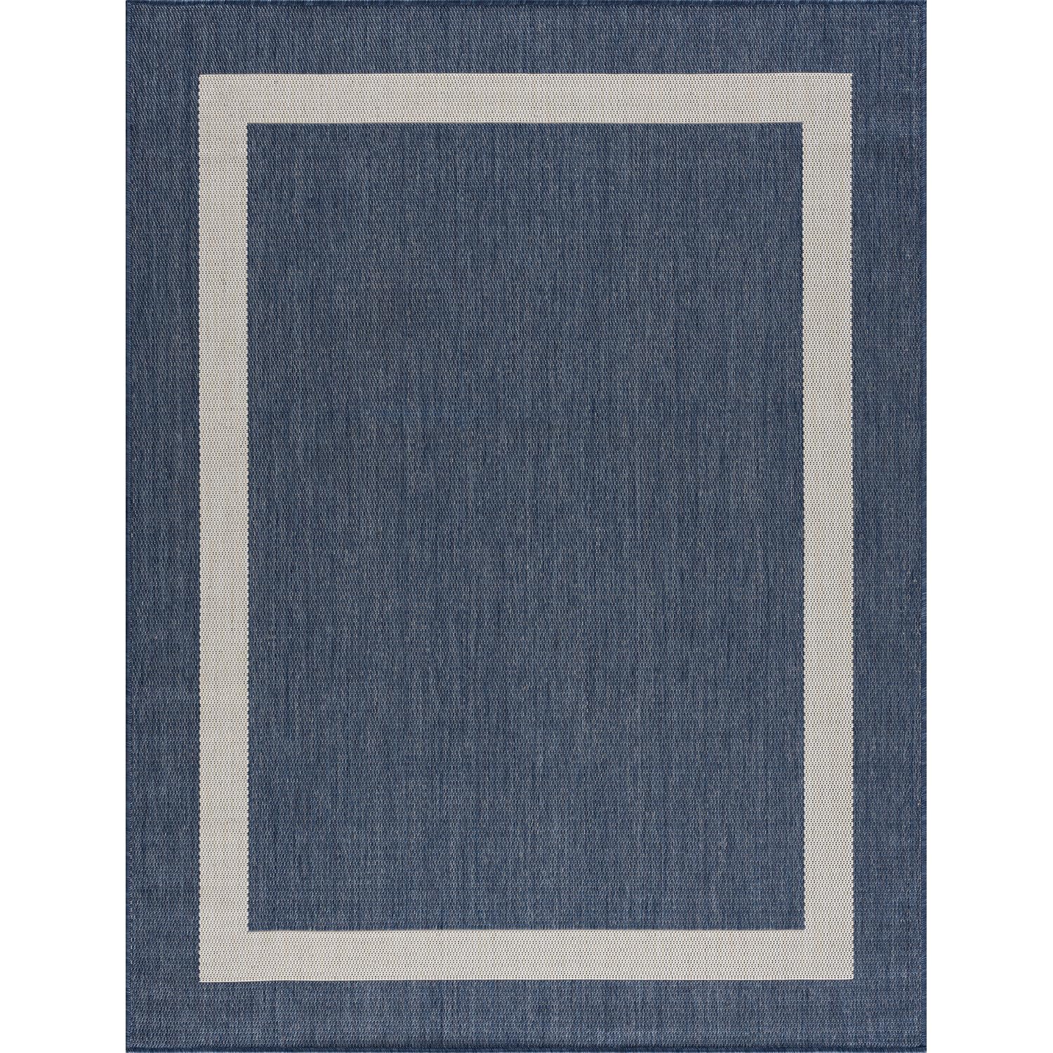 CAMILSON Outdoor Rug displayed on patio setting