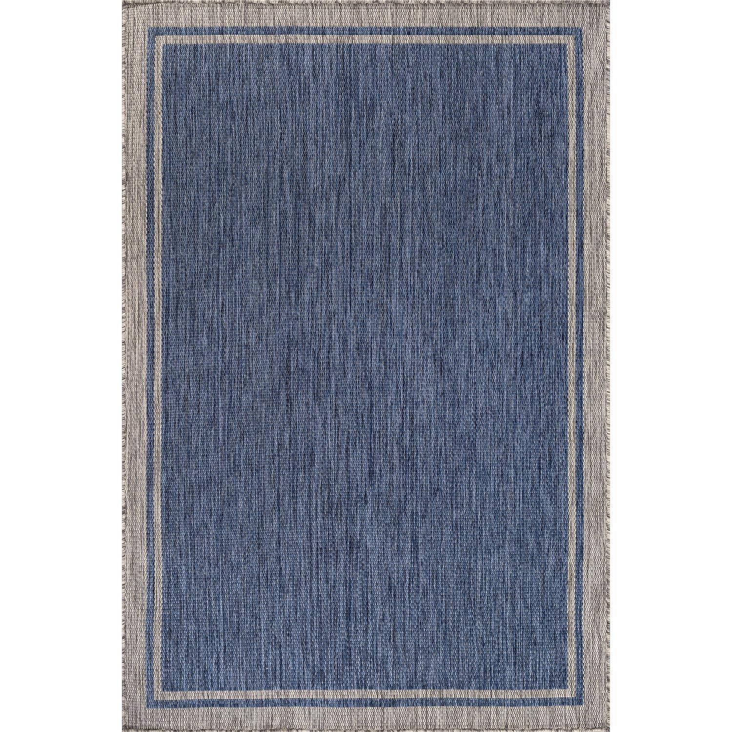 CAMILSON Outdoor Rug in outdoor patio setting