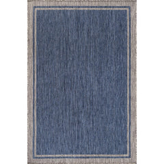 CAMILSON Outdoor Rug in outdoor patio setting