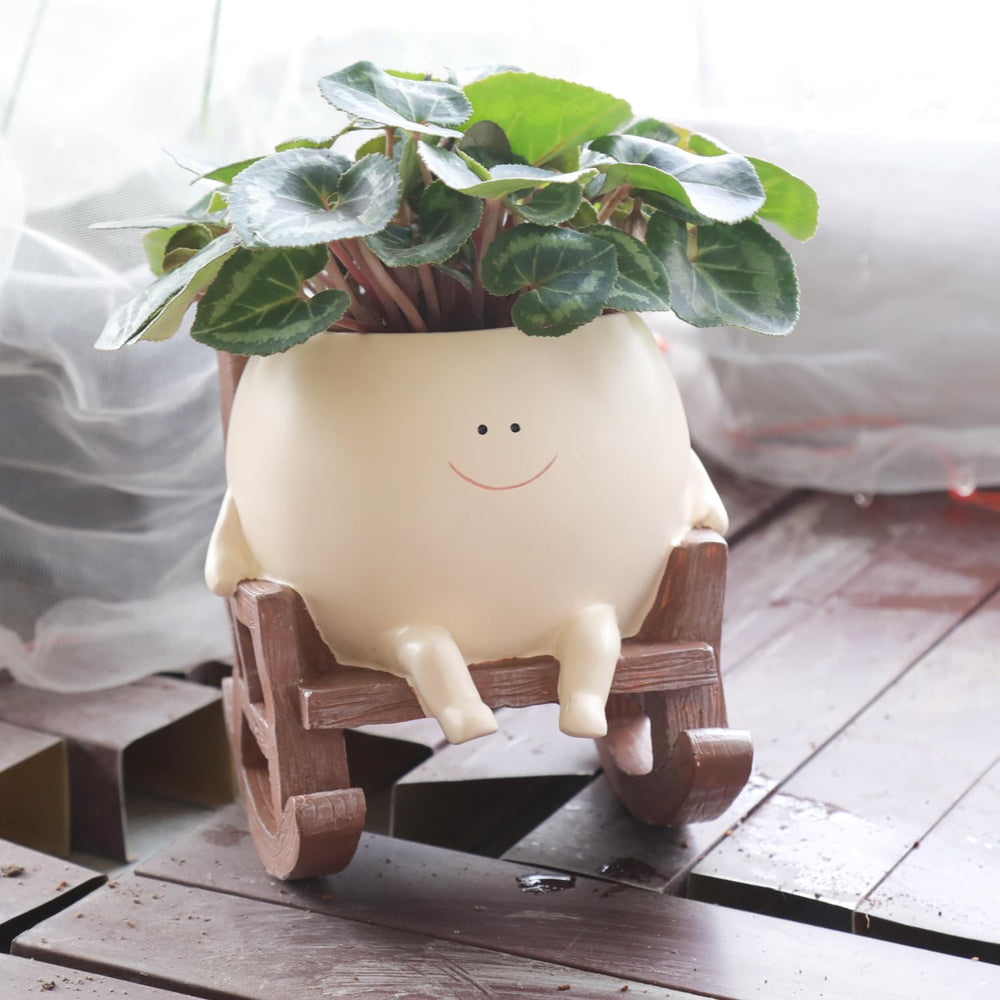 Camotank Smiley Face Rocking Chair Planter front view, beige resin