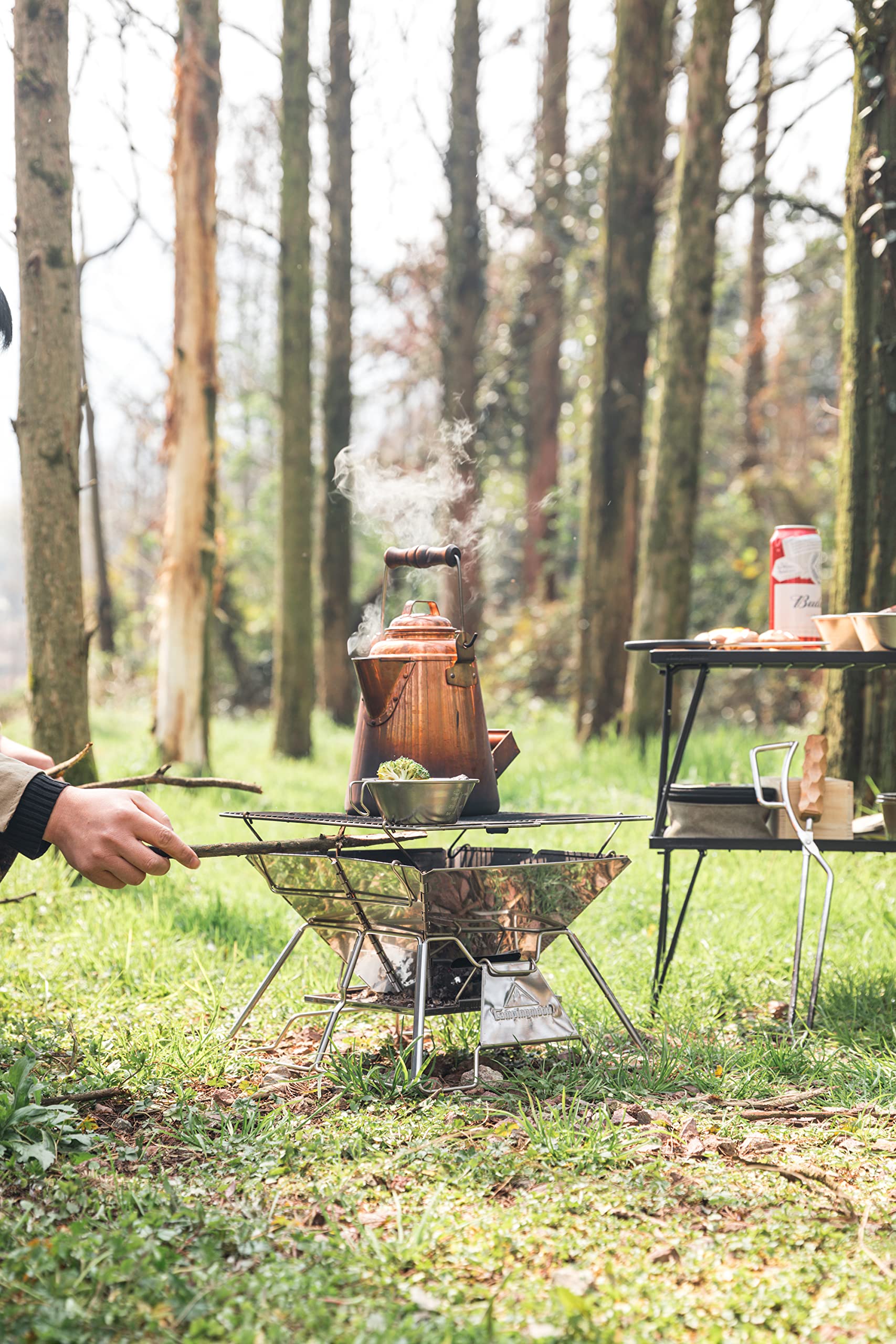Camping Moon fire pit grill with raised coal grate