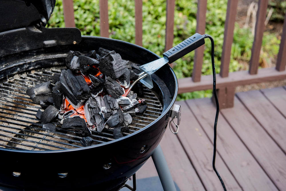 Charbroil Electric Charcoal Starter in use lighting briquettes