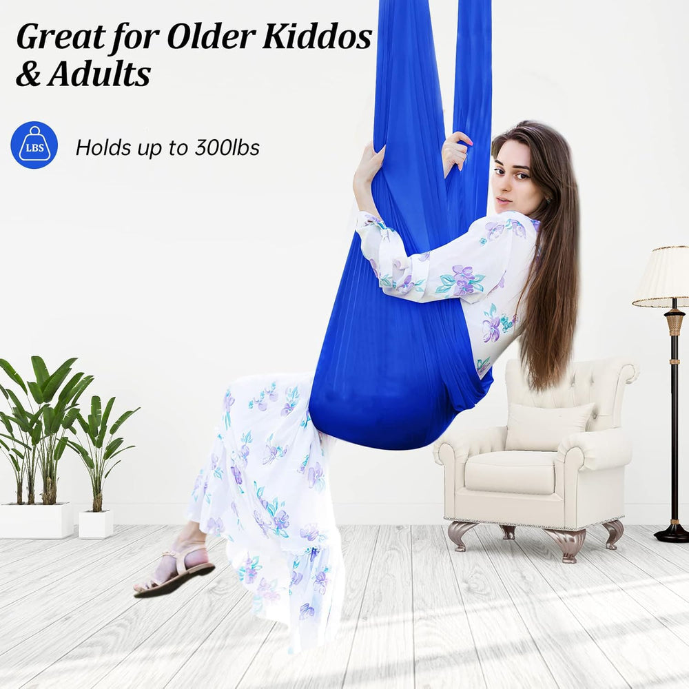 Child relaxing in Aokitec Sensory Swing indoors
