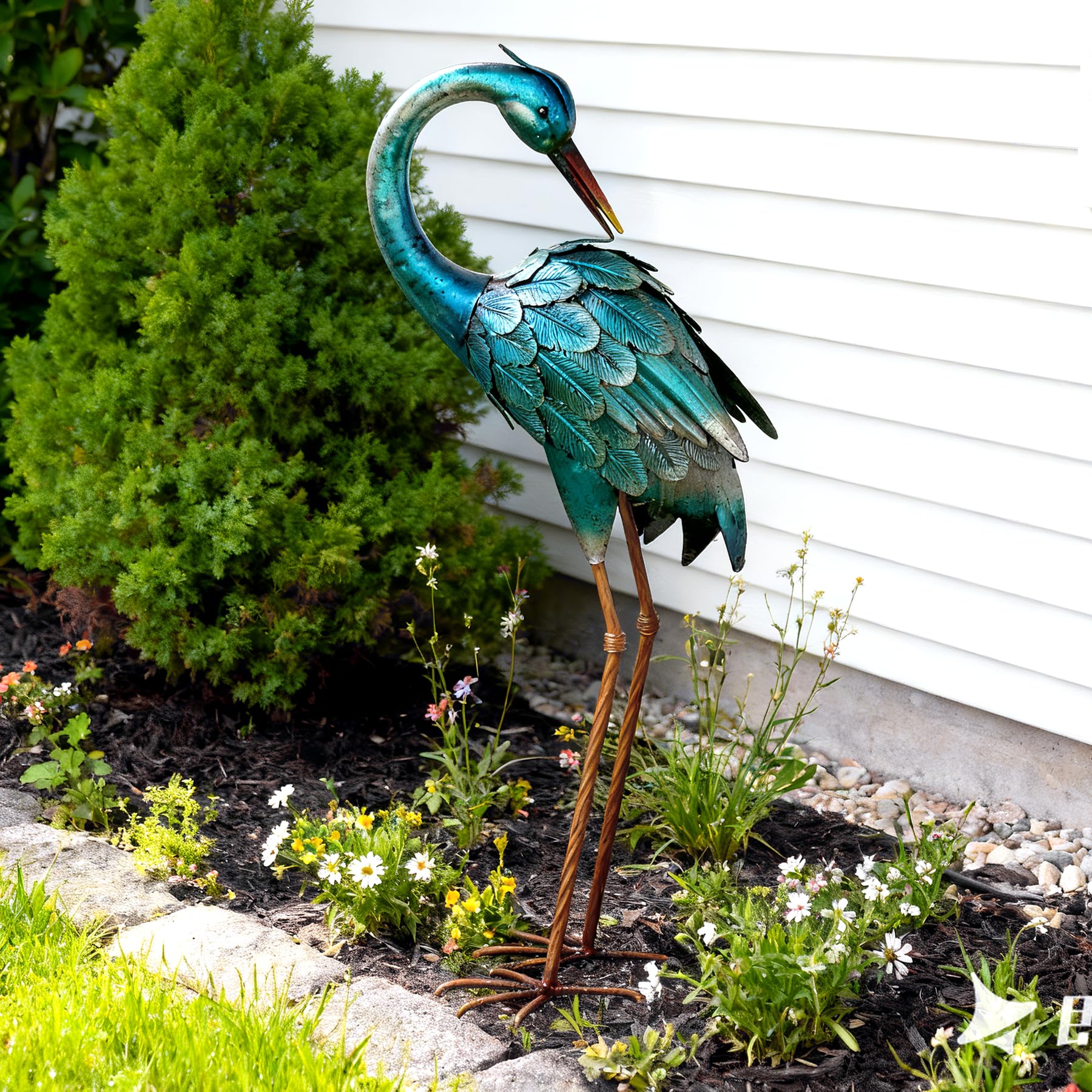 chisheen Crane Garden Statue standing tall among garden plants