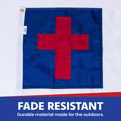 Christian Flag 3x5 displayed outdoors in a garden setting