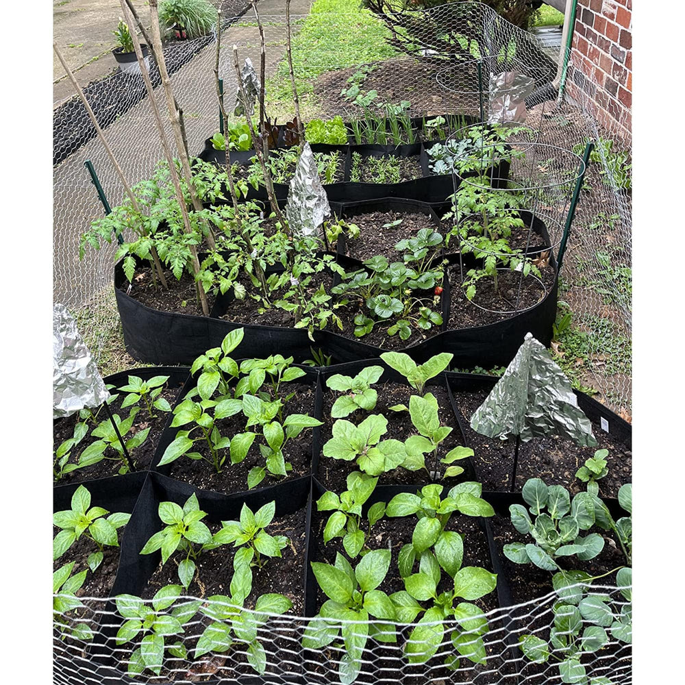 CJGQ Fabric Raised Garden Bed in a garden setting