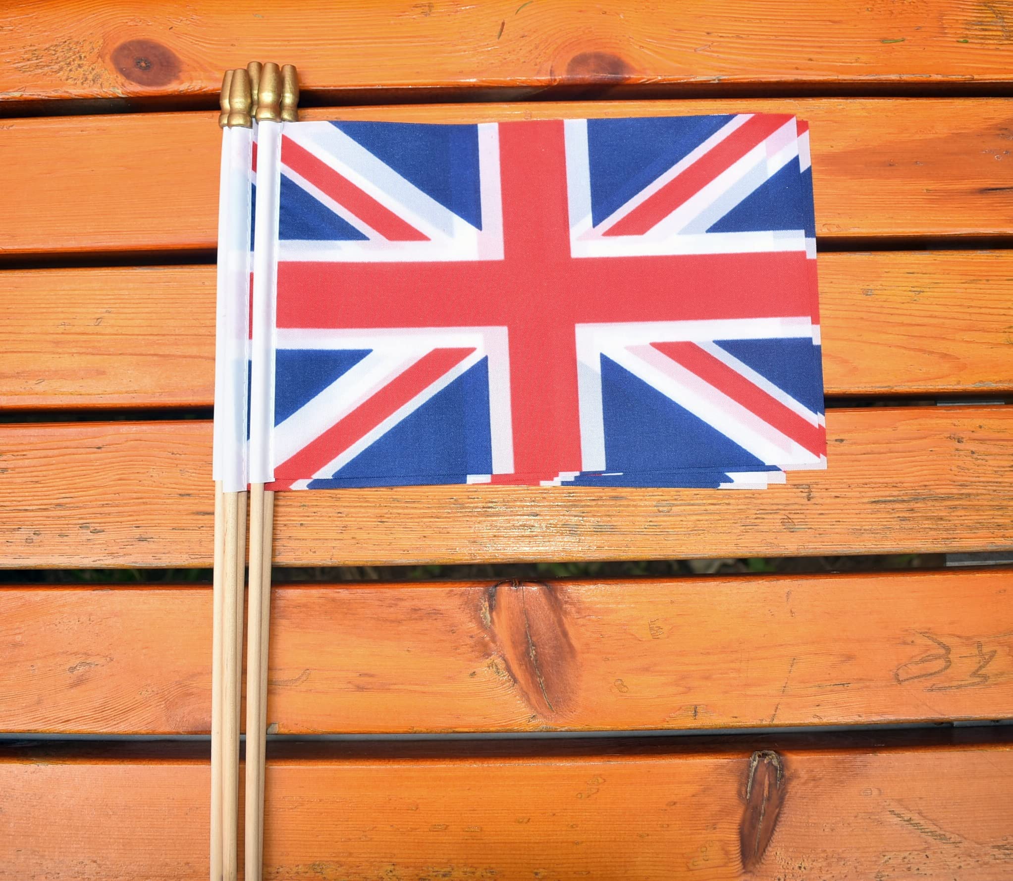 Ckexin UK flags in a garden setting