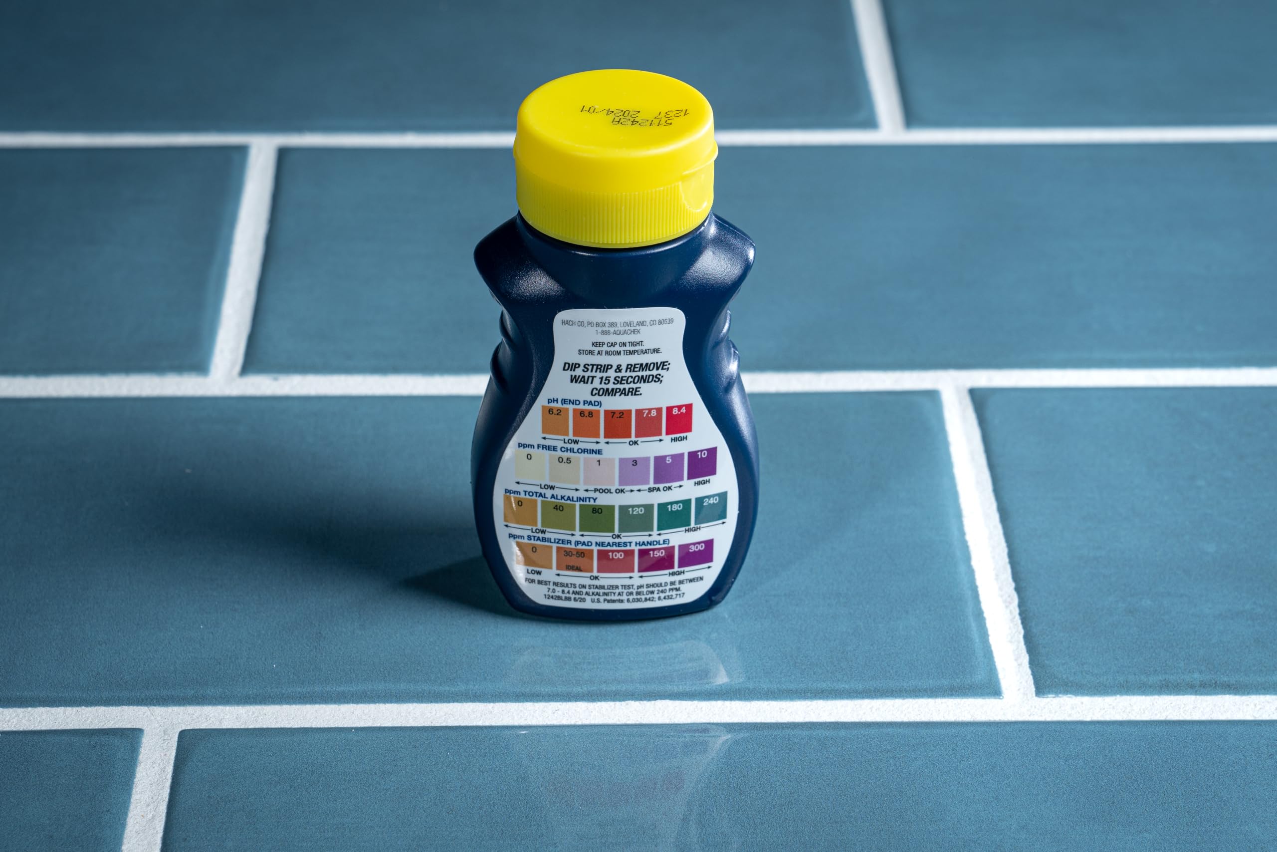 Close-up of AquaChek test strip showing pH results