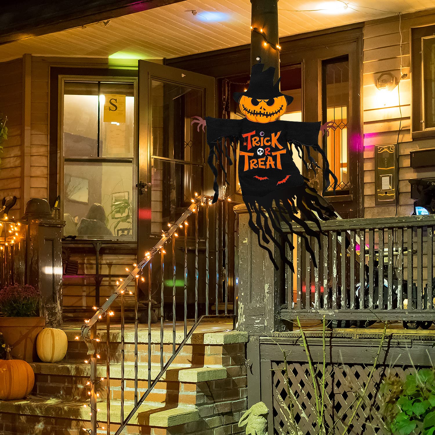 Close-up of COCHIE Halloween garden flag with tassel streamers