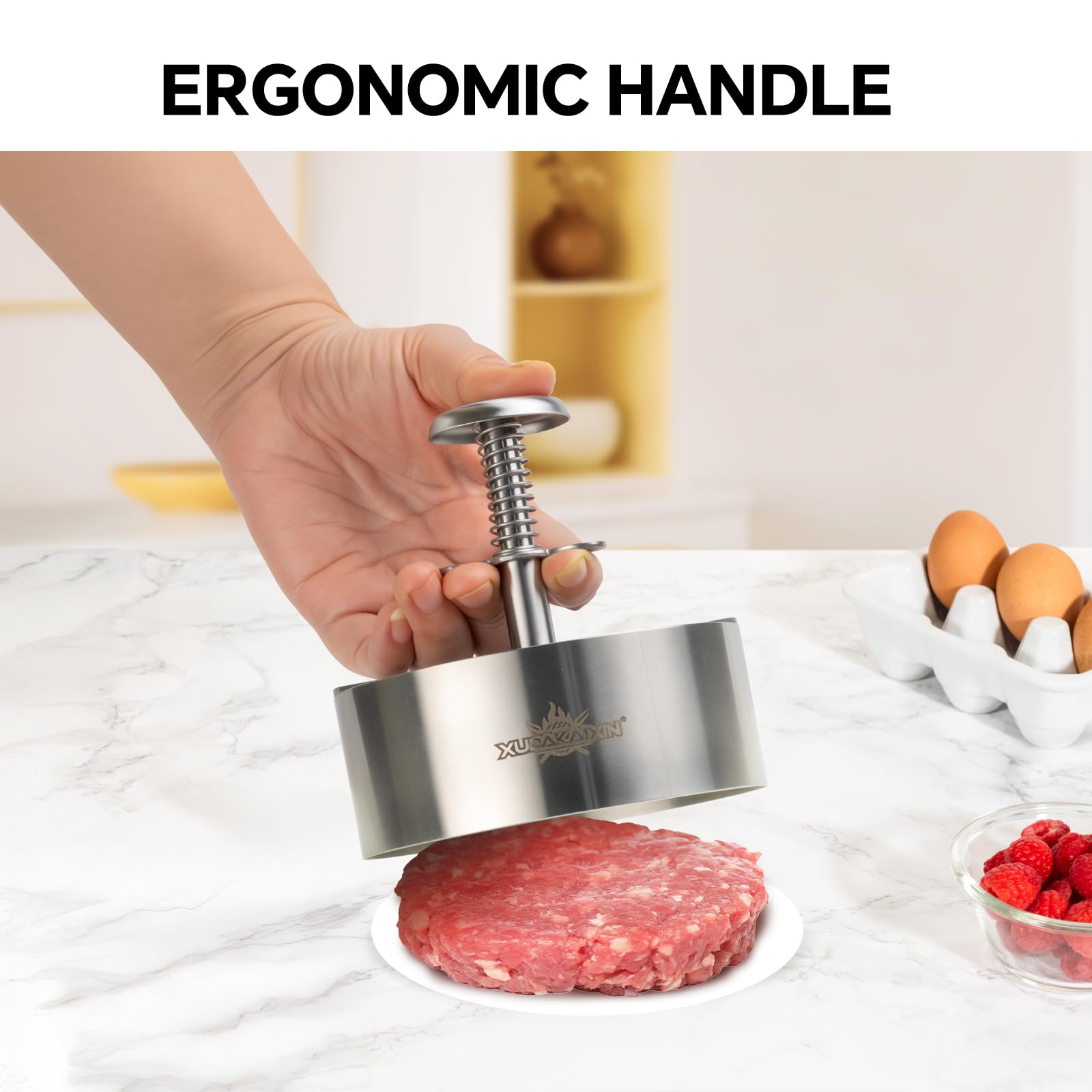 Close-up of Cuexorik stainless steel hamburger press showing texture