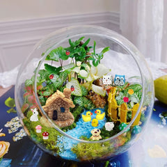 Close-up of Dracarys fairy garden accessories with ladybugs and miniature animals