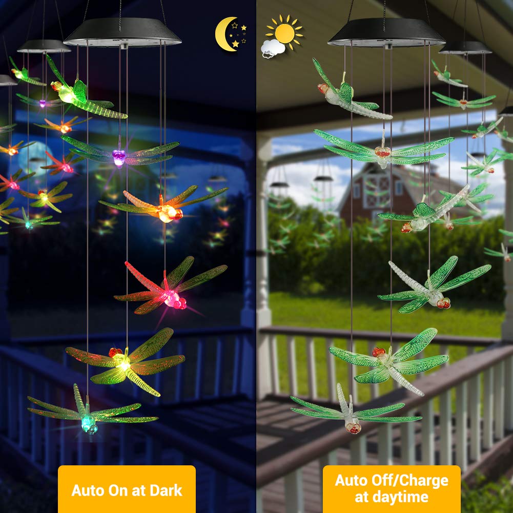 Close-up of dragonfly design on solar wind chimes