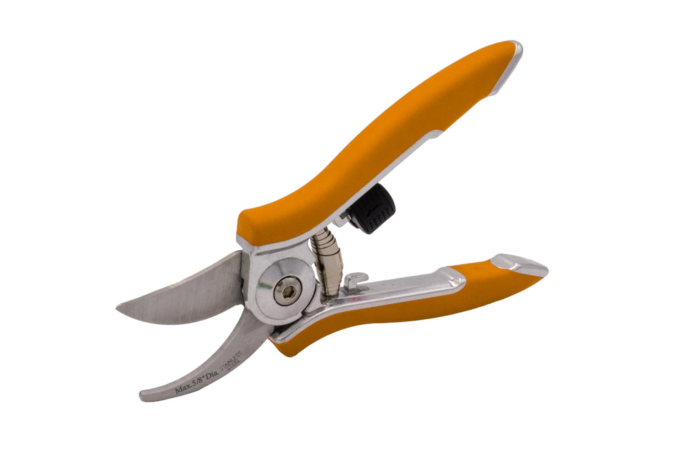 Close-up of Dramm pruning shears showing ergonomic handle and locking mechanism