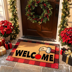 Close-up of festive Santa ornament on Christmas doormat