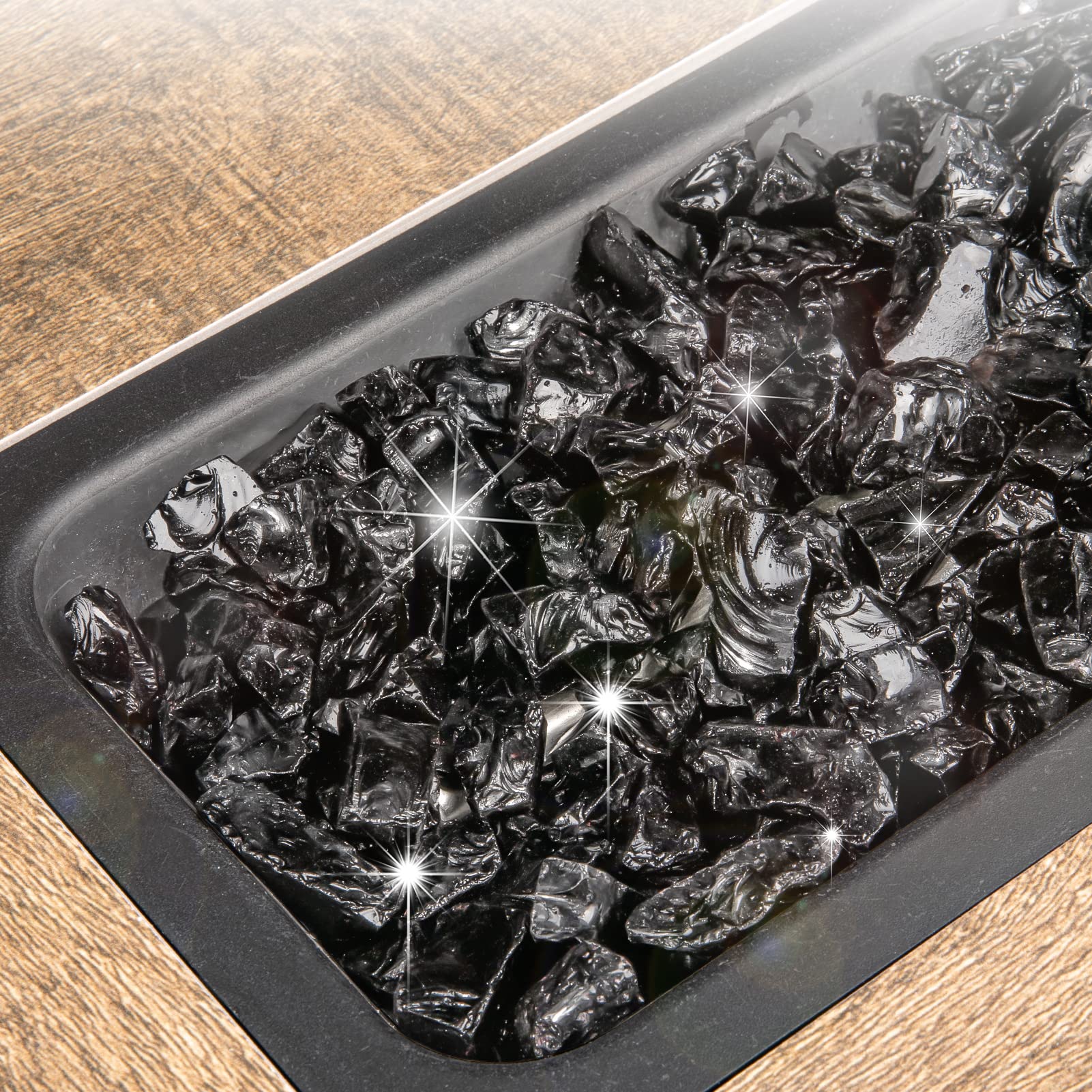 Close-up of GASPRO fire glass showing sparkling texture