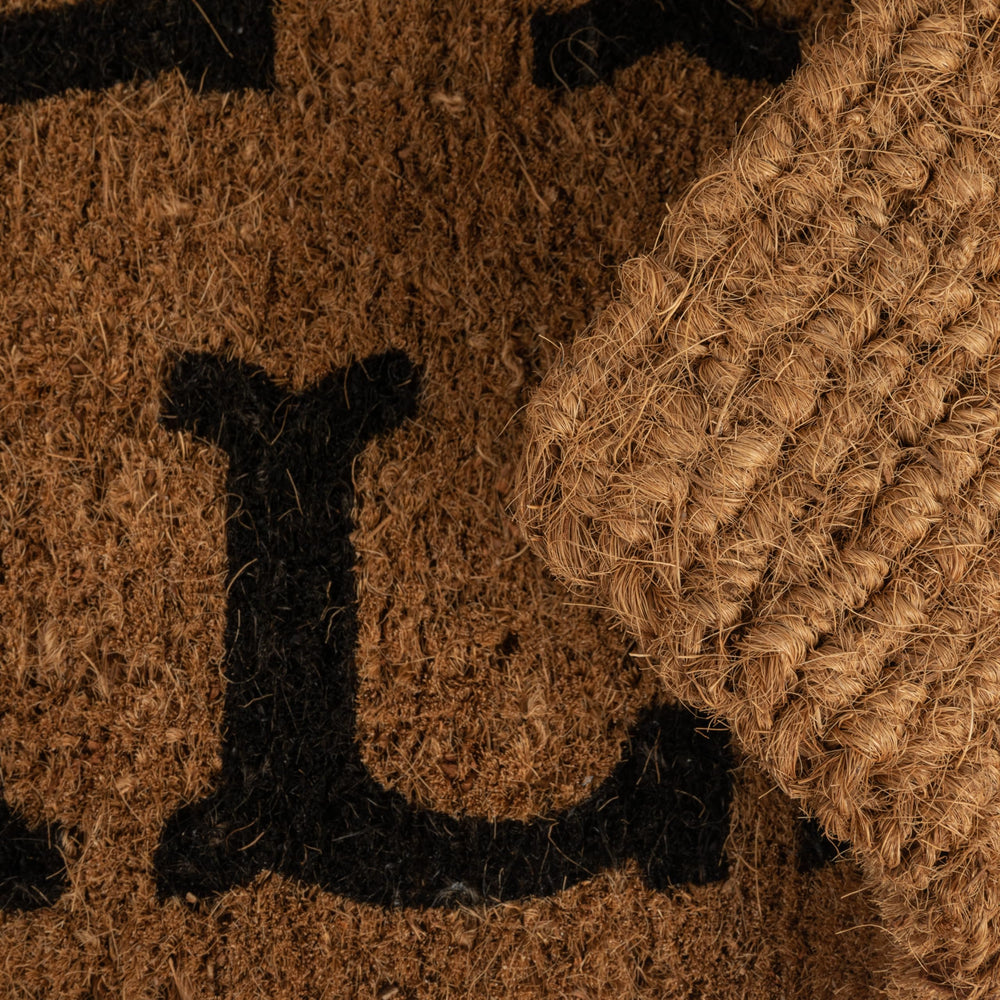 Close-up of 'Hey Y'all' text on Creative Co-Op Doormat